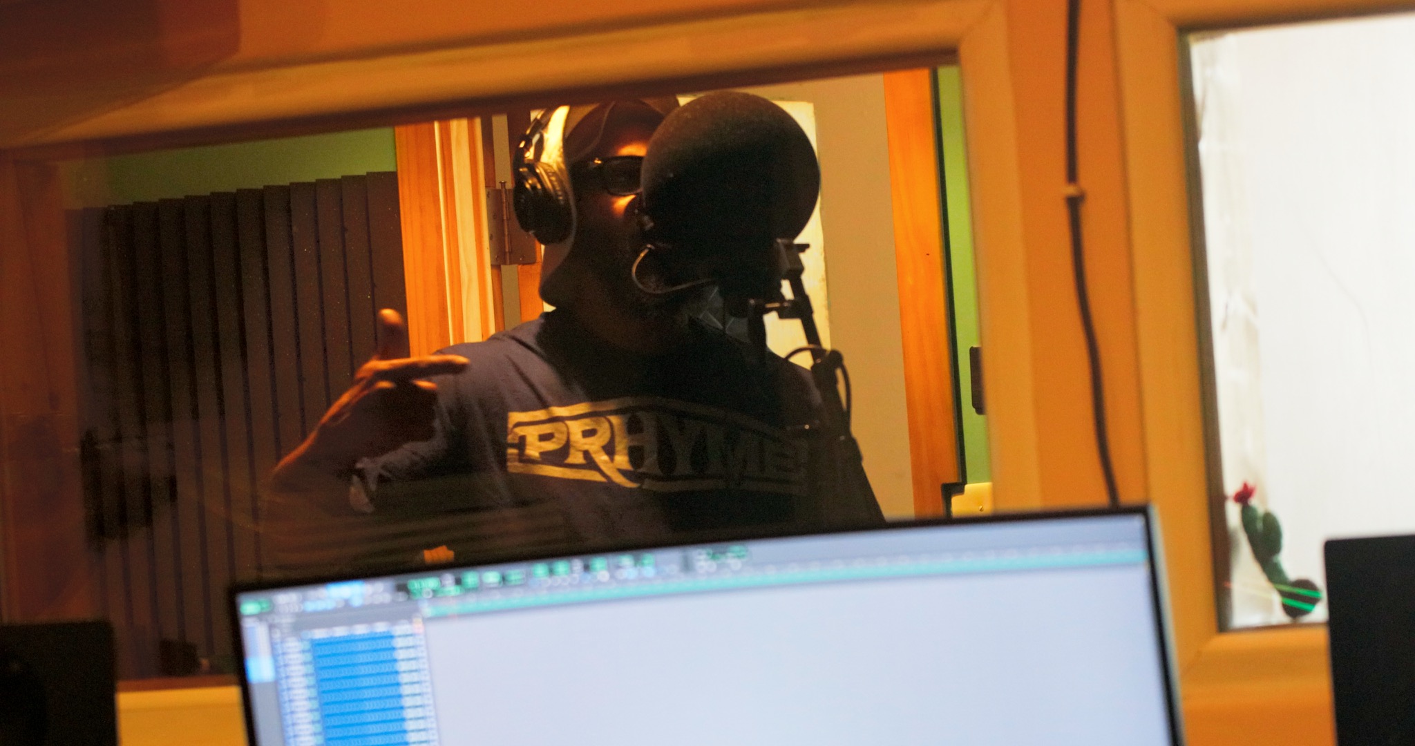 Islam Rap God recording in the studio